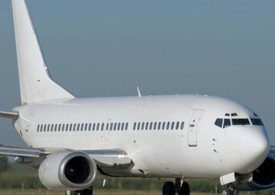 A White boeing 737-200 taxiing