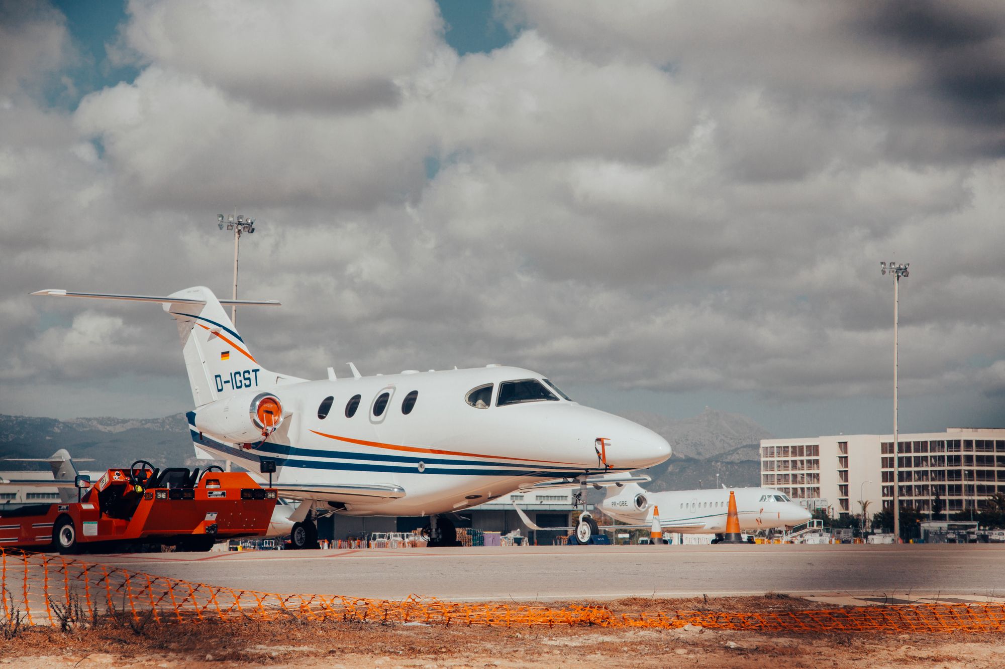 What an FBO does on the apron: business jet parked with terminal behind What an FBO does on the apron: business jet parked with terminal behind