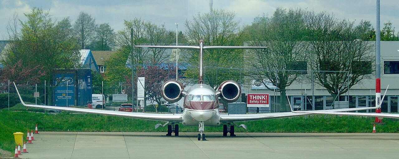 Private jet on the apron outside terminal buildings at a business-aviation airport Private jet on the apron outside terminal buildings at a business-aviation airport